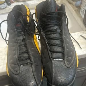 Jordan 13 de la sol black and gold shoes